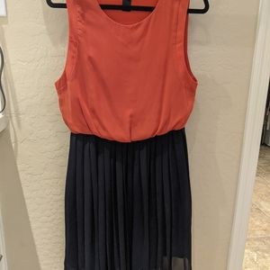 Orange and navy pleated dress